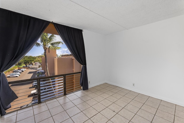 3676 Lower Honoapiilani Rd Unit G302, Lahaina, HI 96761 - tiled empty room featuring a textured ceiling