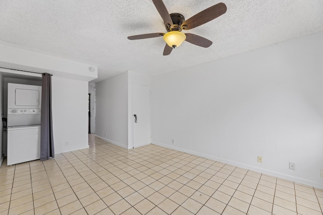 3676 Lower Honoapiilani Rd Unit G302, Lahaina, HI 96761 - spare room with stacked washer and clothes dryer, a textured ceiling, ceiling fan, and light tile patterned flooring