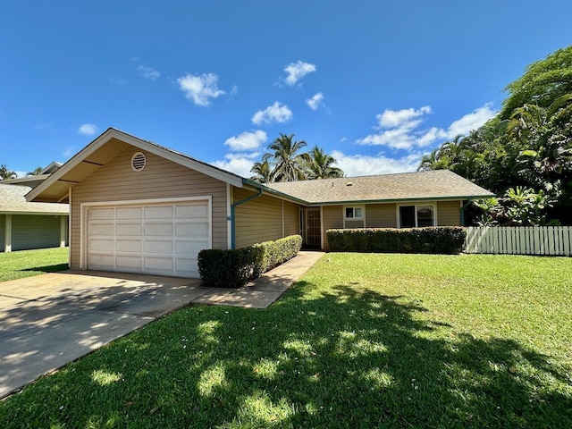 single story home featuring a garage and a front yard