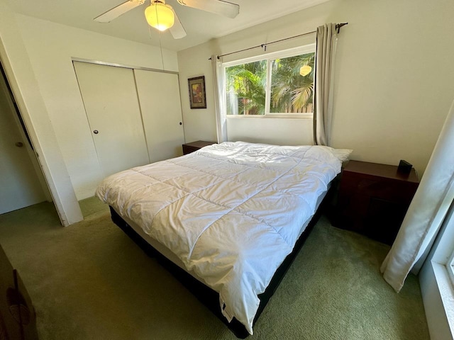 bedroom featuring carpet floors, a closet, and ceiling fan