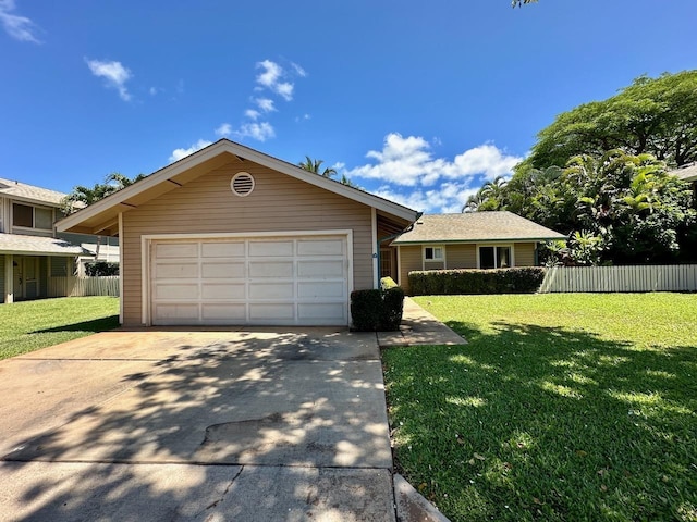 single story home with a front yard and a garage