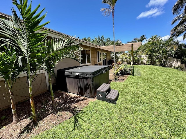 view of yard with a hot tub