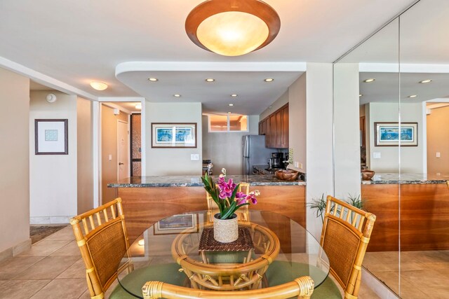 110 Kaanapali Shores Pl Unit 308, Lahaina, HI 96761 - dining room with light tile patterned floors, recessed lighting, and baseboards