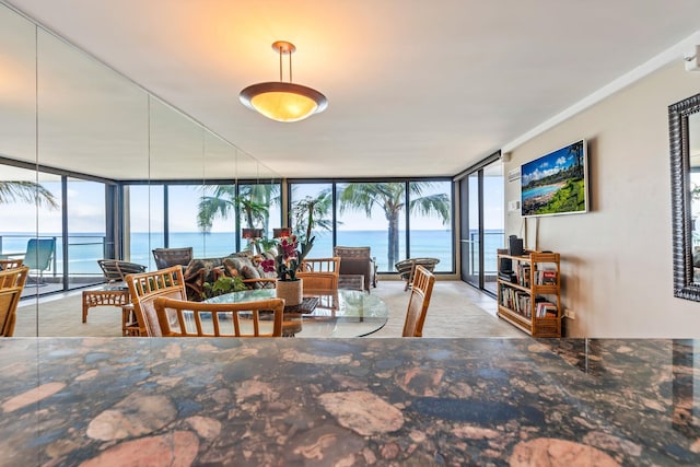 110 Kaanapali Shores Pl Unit 308, Lahaina, HI 96761 - dining space featuring expansive windows and healthy amount of natural light