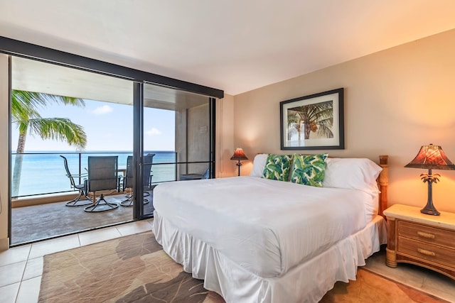 110 Kaanapali Shores Pl Unit 308, Lahaina, HI 96761 - bedroom with multiple windows, access to outside, and tile patterned floors