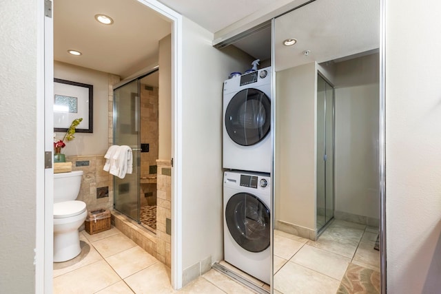 110 Kaanapali Shores Pl Unit 308, Lahaina, HI 96761 - bathroom featuring stacked washer / dryer, tile patterned floors, toilet, a shower stall, and recessed lighting