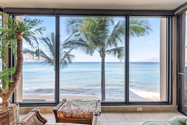 110 Kaanapali Shores Pl Unit 308, Lahaina, HI 96761 - sitting room with view of water and beach and tile patterned floors