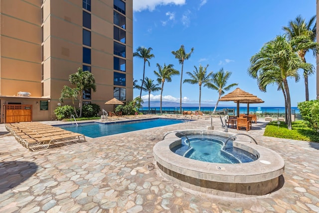110 Kaanapali Shores Pl Unit 308, Lahaina, HI 96761 - community pool featuring a community hot tub, a patio area, and a water view