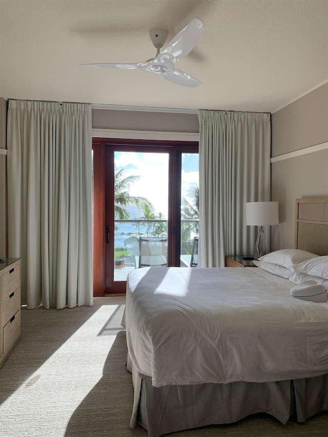 bedroom with carpet, access to exterior, and a ceiling fan