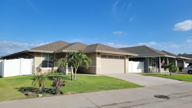 ranch-style home with a front lawn, concrete driveway, a garage, and fence