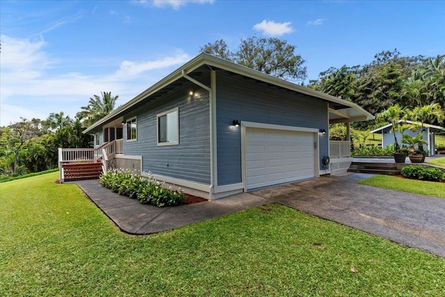 view of property exterior featuring a yard and a garage