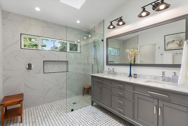 bathroom featuring a shower with door, tile floors, and dual vanity