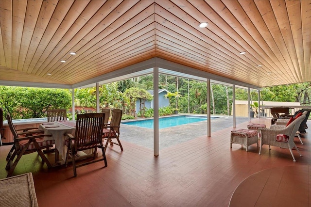 view of pool with a wooden deck