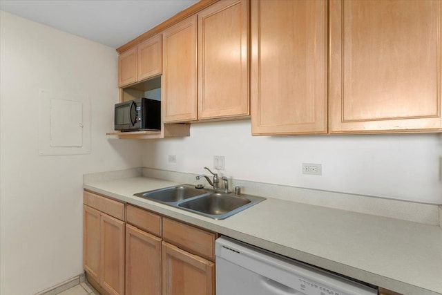 kitchen with white dishwasher, sink, and light brown cabinets