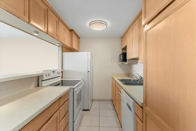 kitchen featuring light tile patterned flooring, sink, and white appliances