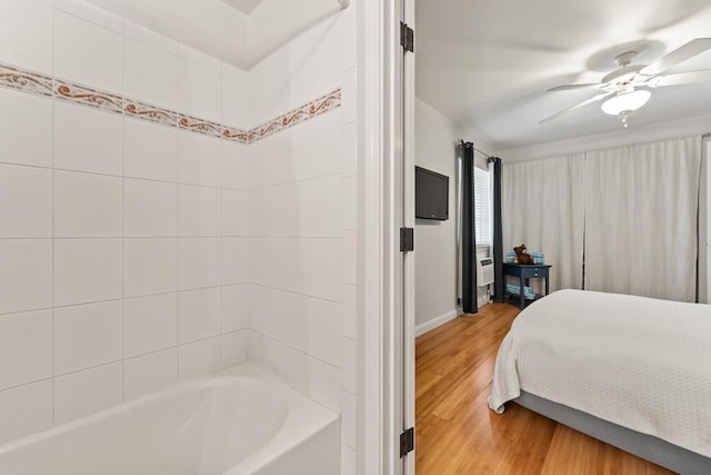 40 Halili Ln Unit 4D, Kihei, HI 96753 - bedroom with light wood finished floors and a ceiling fan