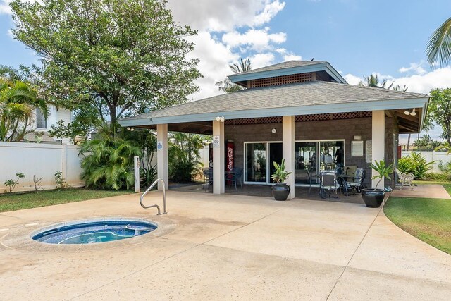 40 Halili Ln Unit 4D, Kihei, HI 96753 - back of house featuring roof with shingles, an in-ground hot tub, and a patio