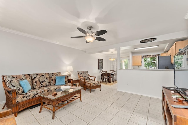 40 Halili Ln Unit 4D, Kihei, HI 96753 - living area featuring light tile patterned flooring, ceiling fan, and crown molding