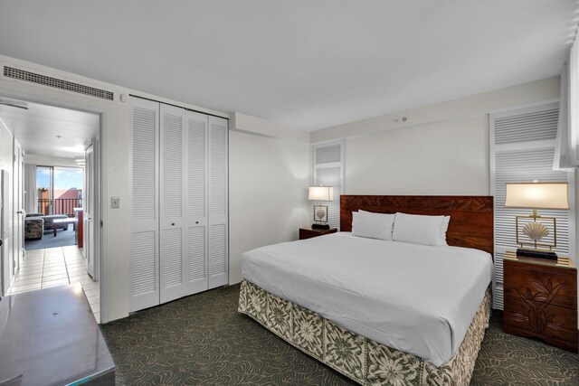 carpeted bedroom with a closet