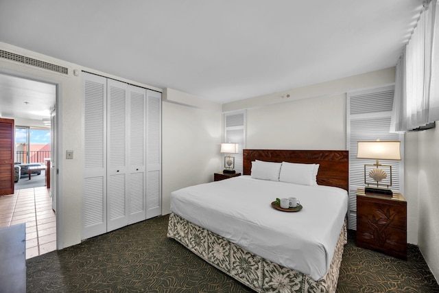 bedroom featuring a closet and carpet flooring