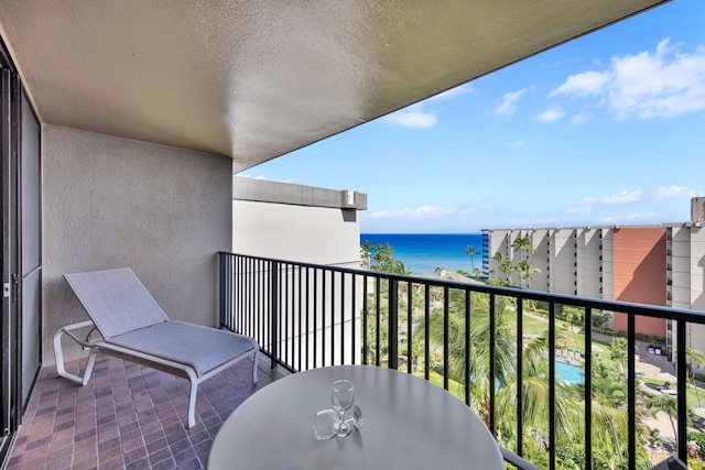 balcony featuring a water view