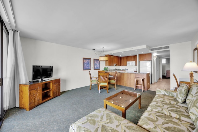 living area featuring light colored carpet