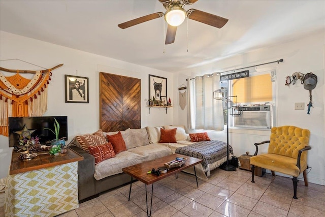 living area with light tile patterned floors, a ceiling fan, and cooling unit