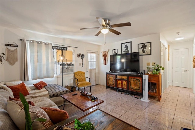 tiled living room featuring a ceiling fan