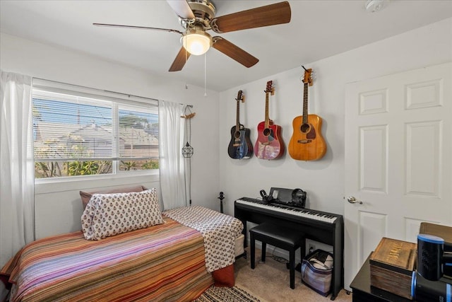 bedroom with light carpet and ceiling fan