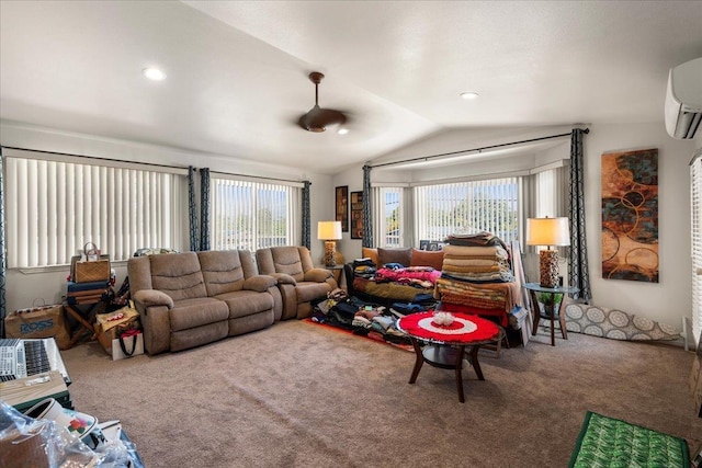 carpeted living area featuring vaulted ceiling, an AC wall unit, and recessed lighting