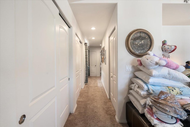 hall with recessed lighting and light colored carpet