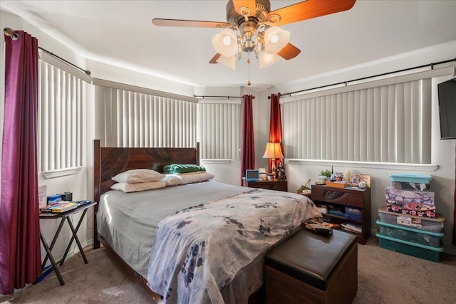 bedroom with ceiling fan and carpet floors