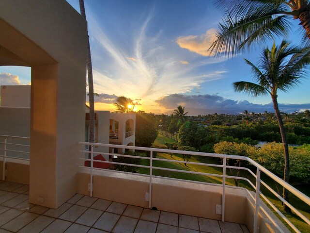 view of balcony at dusk