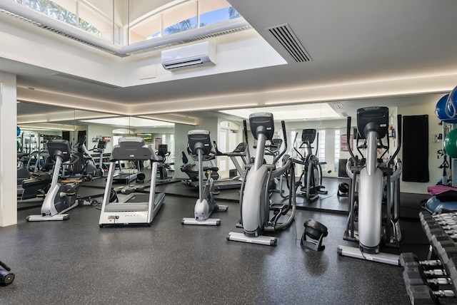 workout area with a wall mounted air conditioner