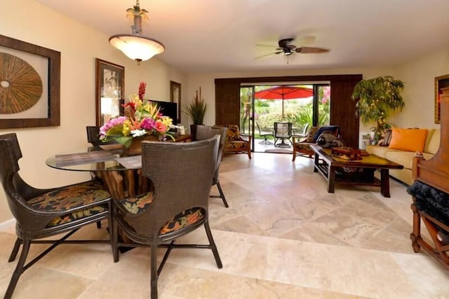 dining room featuring ceiling fan