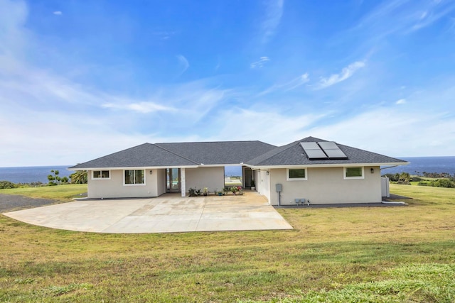 500 Kai Huki Cir Unit B, Haiku, HI 96708 - back of house featuring a patio area, solar panels, a lawn, and stucco siding