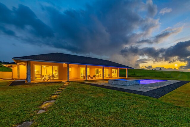 500 Kai Huki Cir Unit B, Haiku, HI 96708 - rear view of house with a patio and a lawn
