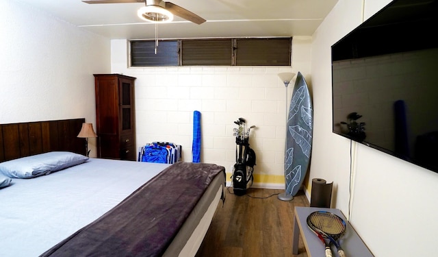 bedroom featuring hardwood / wood-style floors and ceiling fan