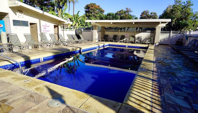 view of swimming pool with a patio