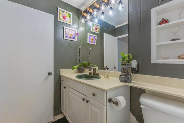 bathroom featuring toilet and vanity