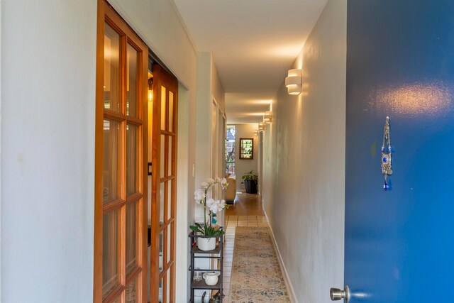 corridor featuring baseboards