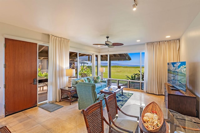 sunroom / solarium with ceiling fan