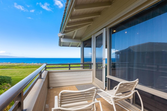 balcony featuring a water view