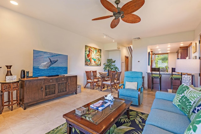 living area with recessed lighting, a ceiling fan, and visible vents