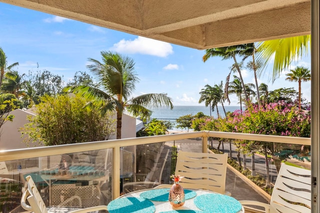 balcony featuring a water view