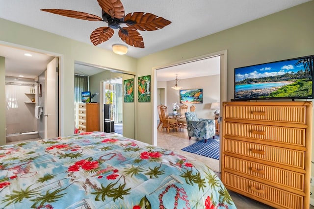 bedroom with connected bathroom, a textured ceiling, a closet, and ceiling fan