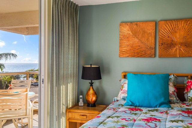 bedroom featuring a water view