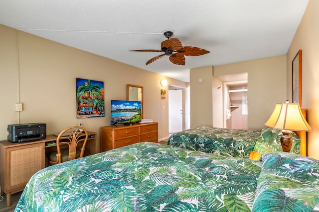 bedroom featuring a textured ceiling and ceiling fan