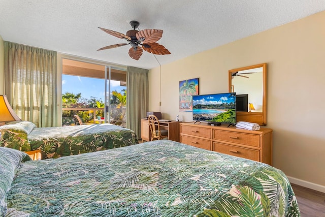 bedroom featuring hardwood / wood-style floors, access to outside, a textured ceiling, and ceiling fan