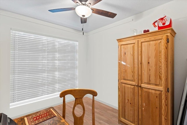 dining room featuring light wood-type flooring and ceiling fan